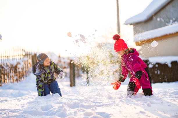 istock Sister and brother on snow 1129193530