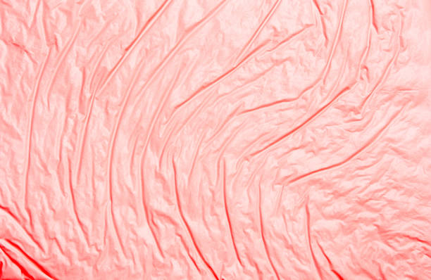 istock Coral abstract background with a rough surface of wavy lines 1129195501