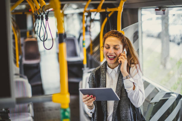 istock Young Businesswoman Taking Public Transportation 1129198824