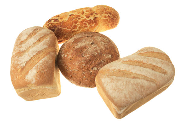istock Several loaves of bread of different types on white background 1129199329