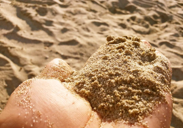 istock Beach sand in the hand, Mediteranean beach in Greece 1129200771