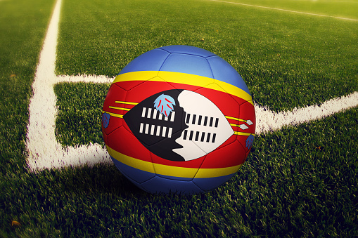 Swaziland ball on corner kick position, soccer field background. National football theme on green grass.