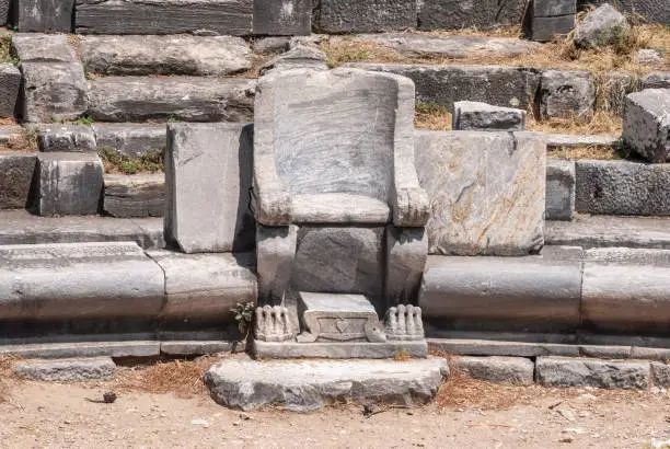 Prohedria marble seat at ruined theatre of Priene ancient city in Turkey.