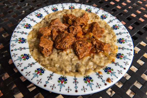 Turkish dish hunkar begendi (Turkish braised lamb and eggplant) Plate of Turkish dish hunkar begendi (Turkish braised lamb and eggplant) hunkar begendi stock pictures, royalty-free photos & images