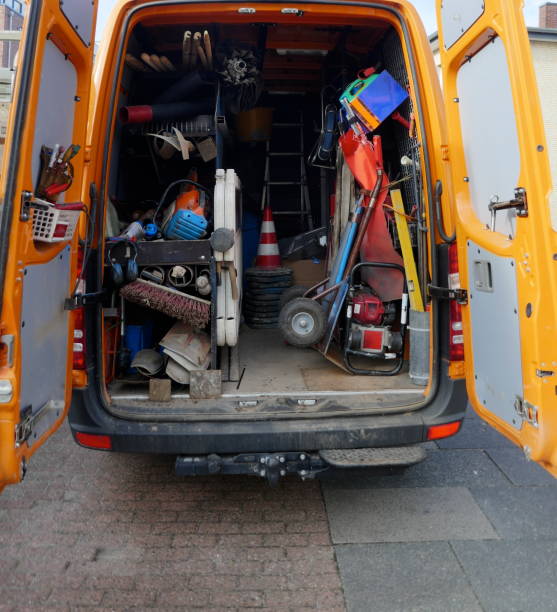 istock Cargo space of a construction vehicle, loaded with various tools, transport cart, barriers, shovels and brooms 1129204722