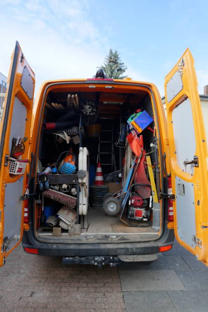 istock Cargo space of a construction vehicle, loaded with various tools, transport cart, barriers, shovels and brooms 1129204723