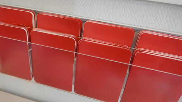 Many red unlabeled sticky notes in a shelf Many red  sticky notes in a shelf büro stock pictures, royalty-free photos & images