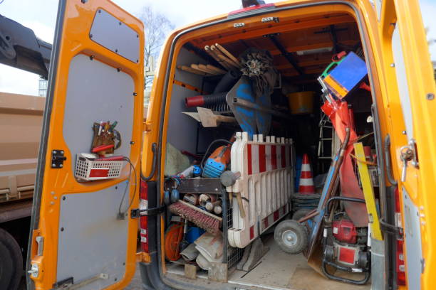 istock Cargo space of a construction vehicle, loaded with various tools, transport cart, barriers, shovels and brooms 1129204730
