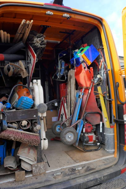 istock Cargo space of a construction vehicle, loaded with various tools, transport cart, barriers, shovels and brooms 1129204764