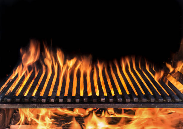 istock Empty grill grate and tongues of fire flame. 1129211529