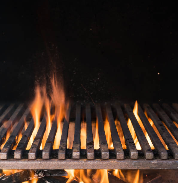 istock Empty grill grate and tongues of fire flame. 1129211533