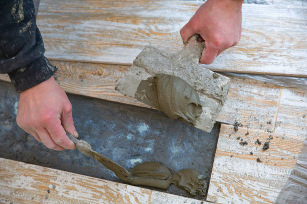 istock laying floor tiles on the building adhesive 1129213269