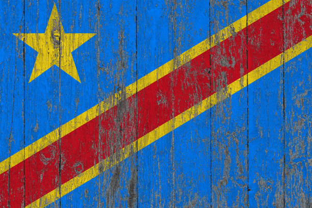 Flag of Democratic Republic of the Congo tattered and torn with stormy sky