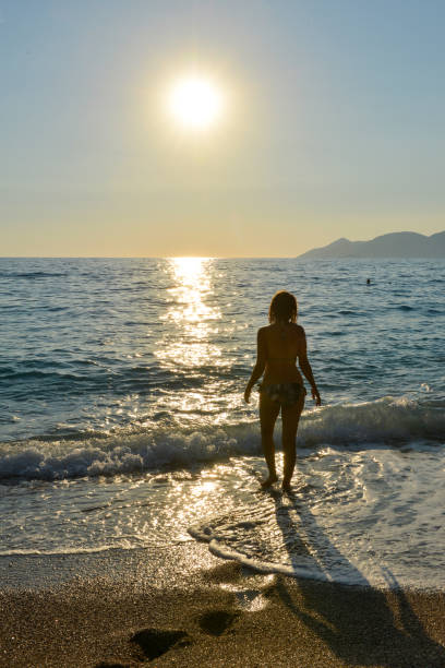 istock Happy woman having fun at sea. 1129213621