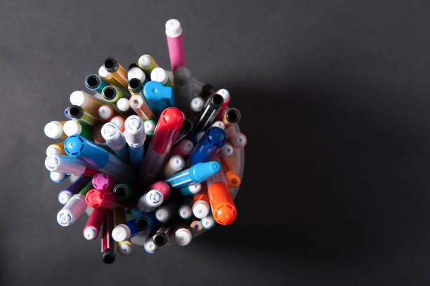 istock pens markers pencils top view 1129213705