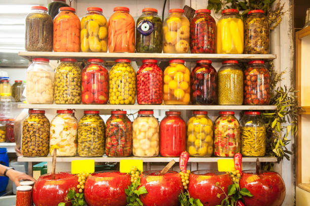 istock Assortment of glass jars filled with pickled vegetables 1129214899