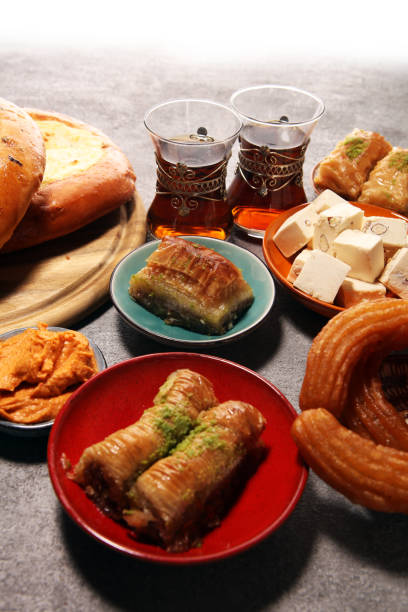 istock Middle eastern or arabic dishes and assorted meze, concrete rustic background. sambusak. Turkish Dessert Baklava with pistachio. Halal food. 1129215209