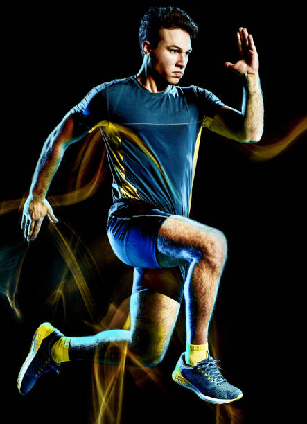 istock runner running jogger jogging man isolated light painting black background 1129215232