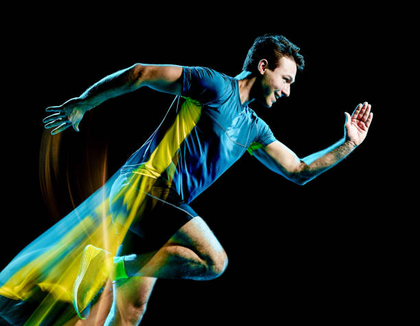 istock runner running jogger jogging man isolated light painting black background 1129215260