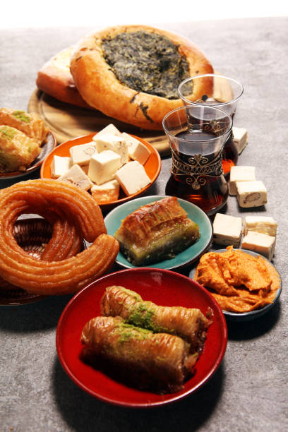 istock Middle eastern or arabic dishes and assorted meze, concrete rustic background. sambusak. Turkish Dessert Baklava with pistachio. Halal food. 1129215269