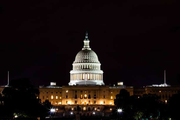 istock United States Capitol in Washington DC at night 1129219694