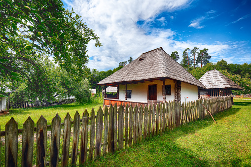 Fantastic summer scene in Transylvania. View of traditional romanian peasant houses. Beauty of countryside rural scene of Transylvania, Romania, Europe.