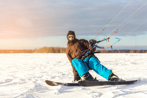 istock The skier goes on the snow field with kite 1129223534