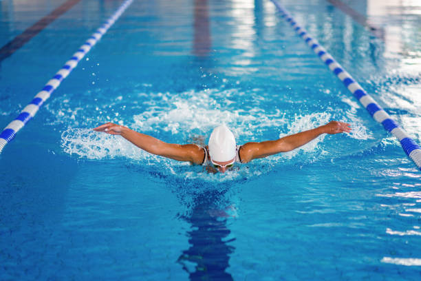 istock Female Swimmer Swimming In Pool 1129226724