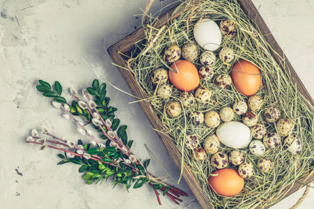 istock Happy Easter greeting card with quail and chicken eggs 1129228349