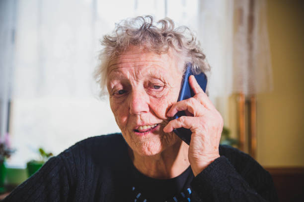 istock Senior woman talking on mobile phone 1129233274