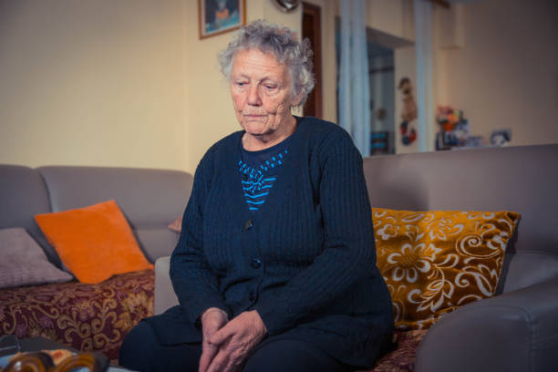 istock Senior woman sitting alone 1129233927