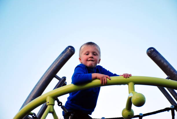 istock Child on Climbing Frame at Children's Park 1129235599
