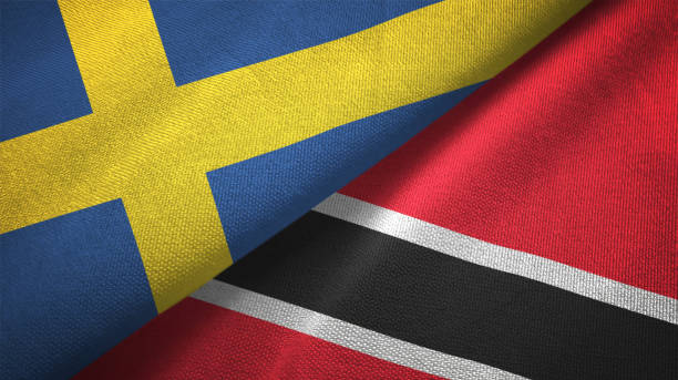 istock Sweden and Trinidad and Tobago two flags textile cloth, fabric texture 1129235674