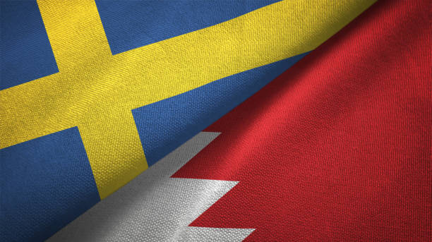 istock Sweden and Bahrain two flags textile cloth, fabric texture 1129235683