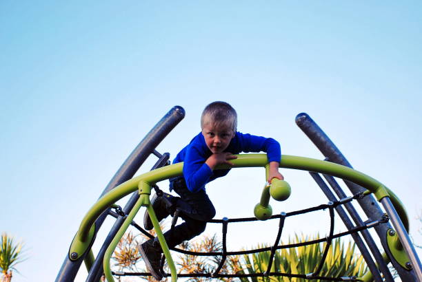 istock Child on Climbing Frame at Children's Park 1129235686
