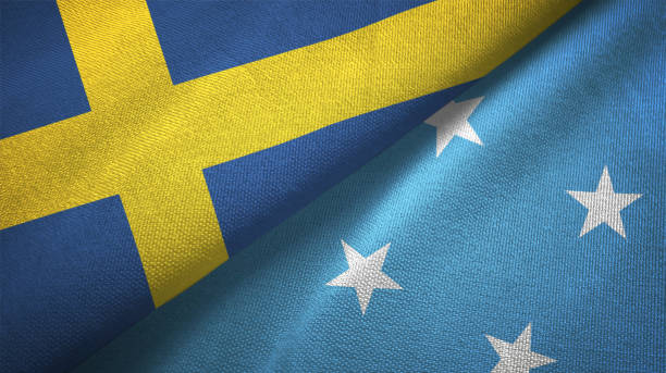 istock Sweden and Micronesia two flags textile cloth, fabric texture 1129235755