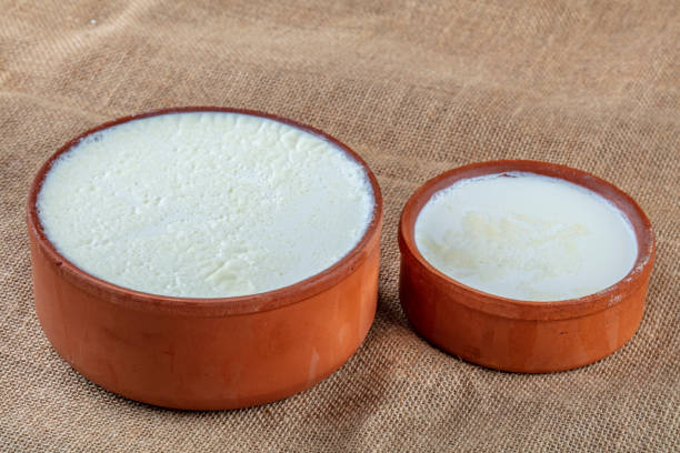 turkish and greek traditional dairy food yogurt or yoghurt in a pot with concept wooden background - yogurt greek culture milk healthy eating imagens e fotografias de stock