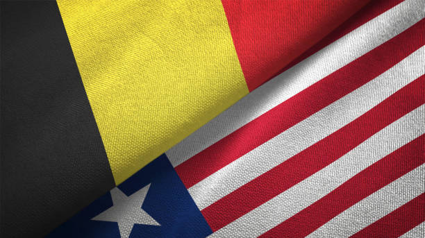 istock Belgium and Liberia two flags textile cloth, fabric texture 1129238513