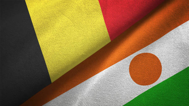 istock Belgium and Niger two flags textile cloth, fabric texture 1129238676