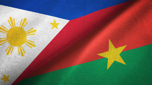 istock Philippines and Burkina Faso two flags textile cloth, fabric texture 1129244418