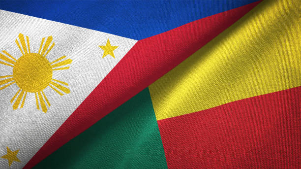 istock Philippines and Benin two flags textile cloth, fabric texture 1129244419