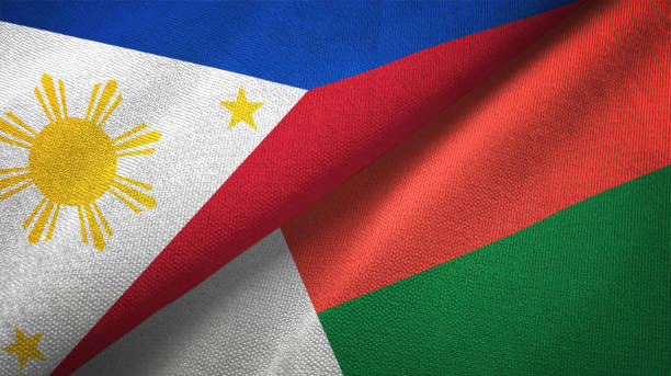 istock Philippines and Madagascar two flags textile cloth, fabric texture 1129244480