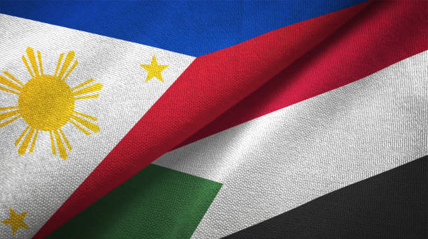 istock Philippines and Sudan two flags textile cloth, fabric texture 1129244534