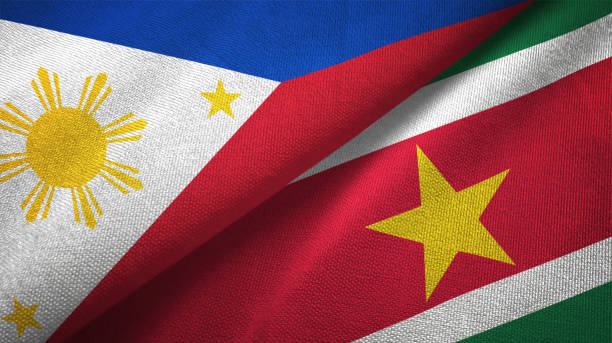 istock Philippines and Suriname two flags textile cloth, fabric texture 1129244540
