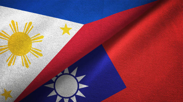 istock Philippines and Taiwan two flags textile cloth, fabric texture 1129244542