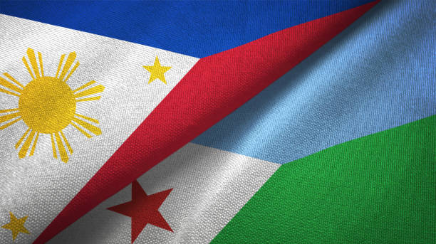 istock Philippines and Djibouti two flags textile cloth, fabric texture 1129244601