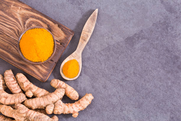 istock Fresh organic root and turmeric powder - Curcuma longa. 1129245248