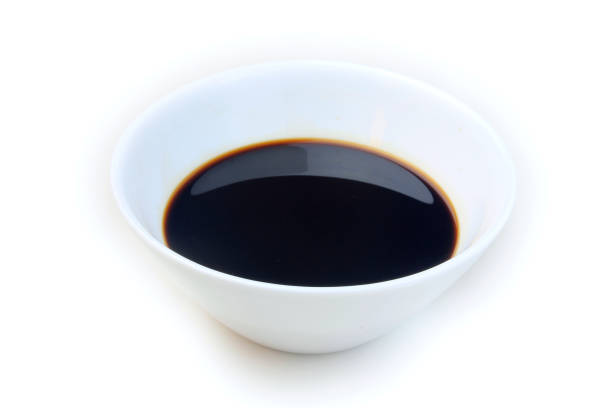 istock Soy sauce in a ceramic bowl isolated on white background, with clipping path. Copy space 1129252391