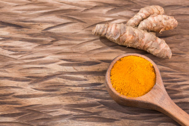 istock Fresh organic root and turmeric powder - Curcuma longa. 1129253387