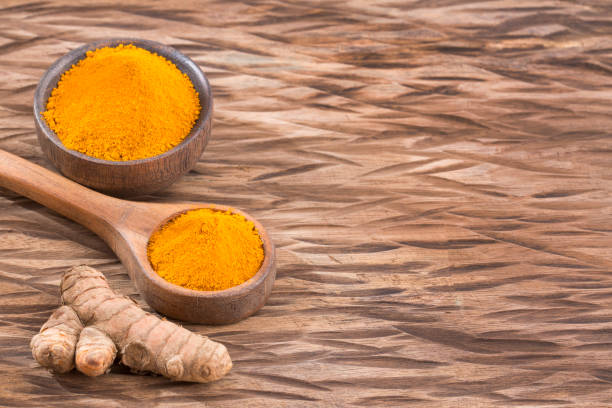 istock Roots and organic turmeric powder - Curcuma longa 1129255581